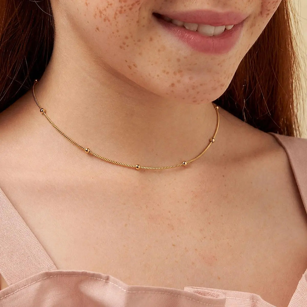 Colar Folheado a Ouro Kids com Esferas Dispersas Lisas